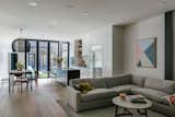 The courtyard is enjoyed from multiple vantage points, including the main living spaces and an office on the main floor, as well as a second-floor hallway and bedrooms.