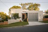 Before & After: She Cloaked Her 1970s Brick Home in a Concrete-and-Metal “Skin”