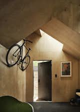 Despite its small footprint, this backyard office in Austin, Texas, includes bike storage and a niche for storing weights.